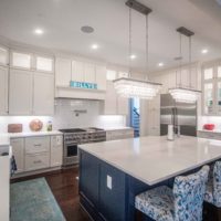 Exploring the Art of Residential Architecture: Defining Spaces for Living, modern white kitchen with blue accents