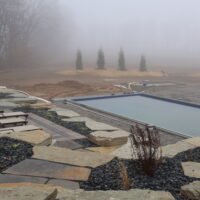 view of beach chairs overlooking pool