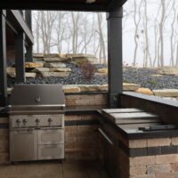 backyard patio area with grill