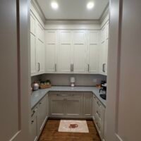 big pantry with many cabinets
