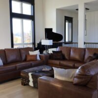 three couches surrounding a coffee table