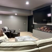 living room with couches and a tv