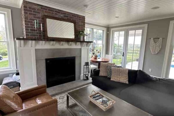 A classic Eames Lounge Chair showcasing curved plywood and leather in a modern room - mid century design