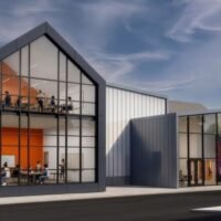 Rendering of the Franklinton High School addition with a glass gable revealing classrooms on two levels